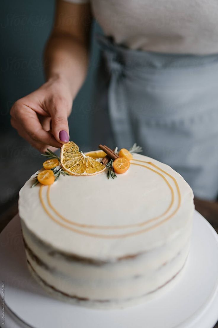 The delicious cake is decorated with slices of orange