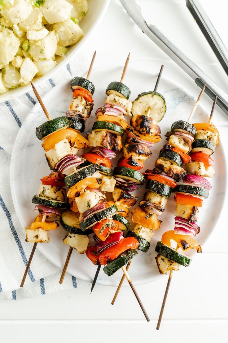 vegetable skewers with alternating colorful bell pepper chunks, cherry tomatoes, and zucchini slices